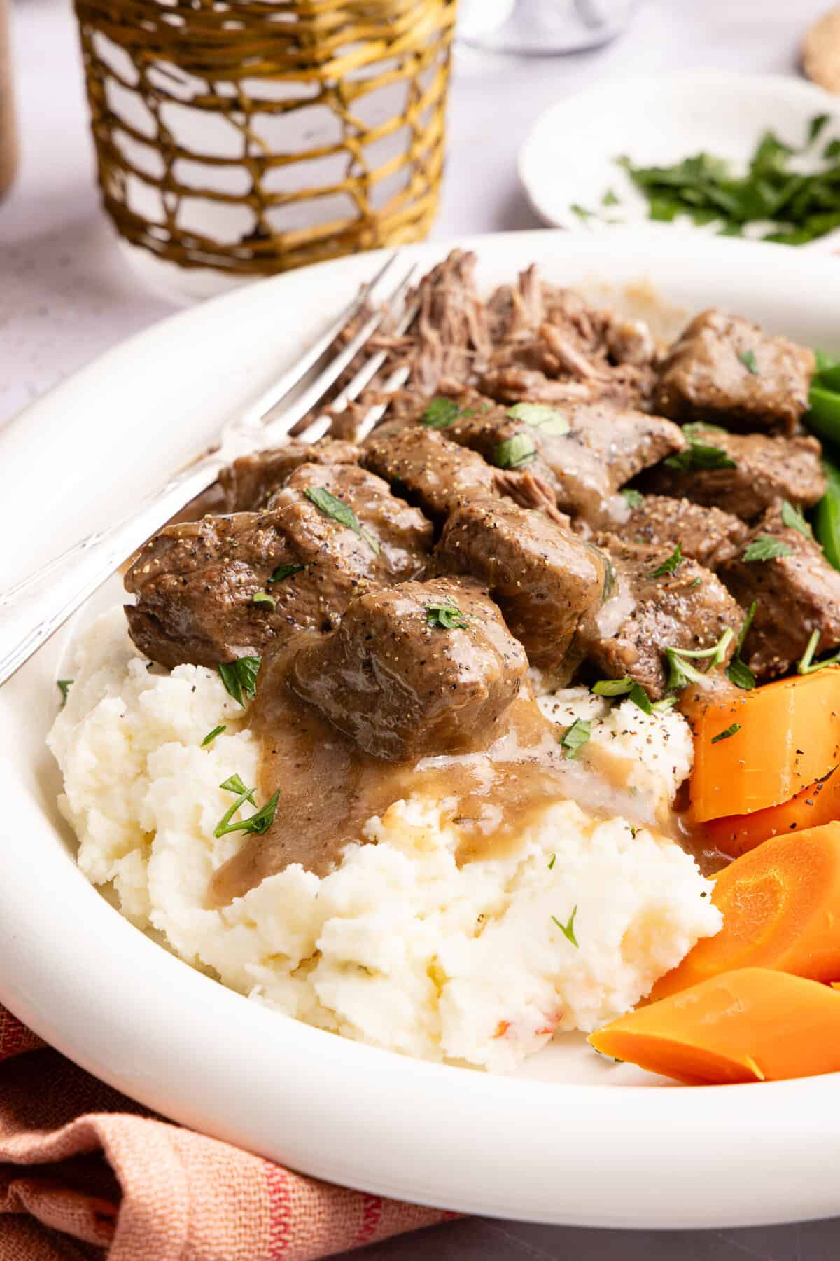 beef tips with gravy over mashed potatoes