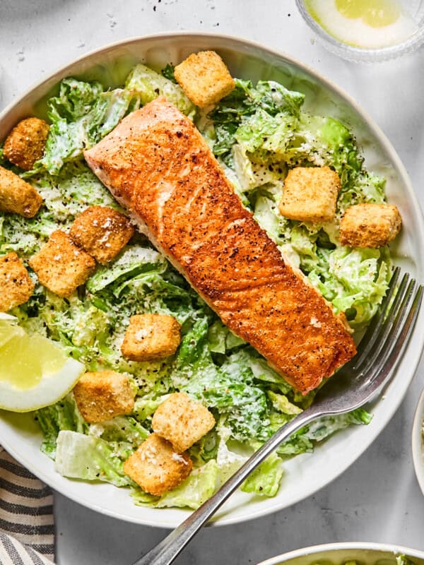 salmon caesar salad in a bowl