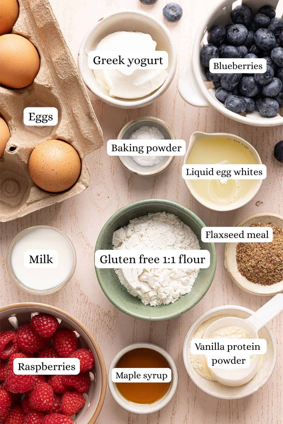 Protein pancake bowl ingredients arranged in labeled nesting bowls.