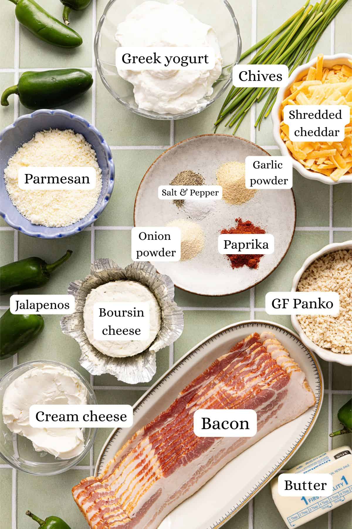 A flat lay of jalapeño popper dip ingredients labeled on a countertop.