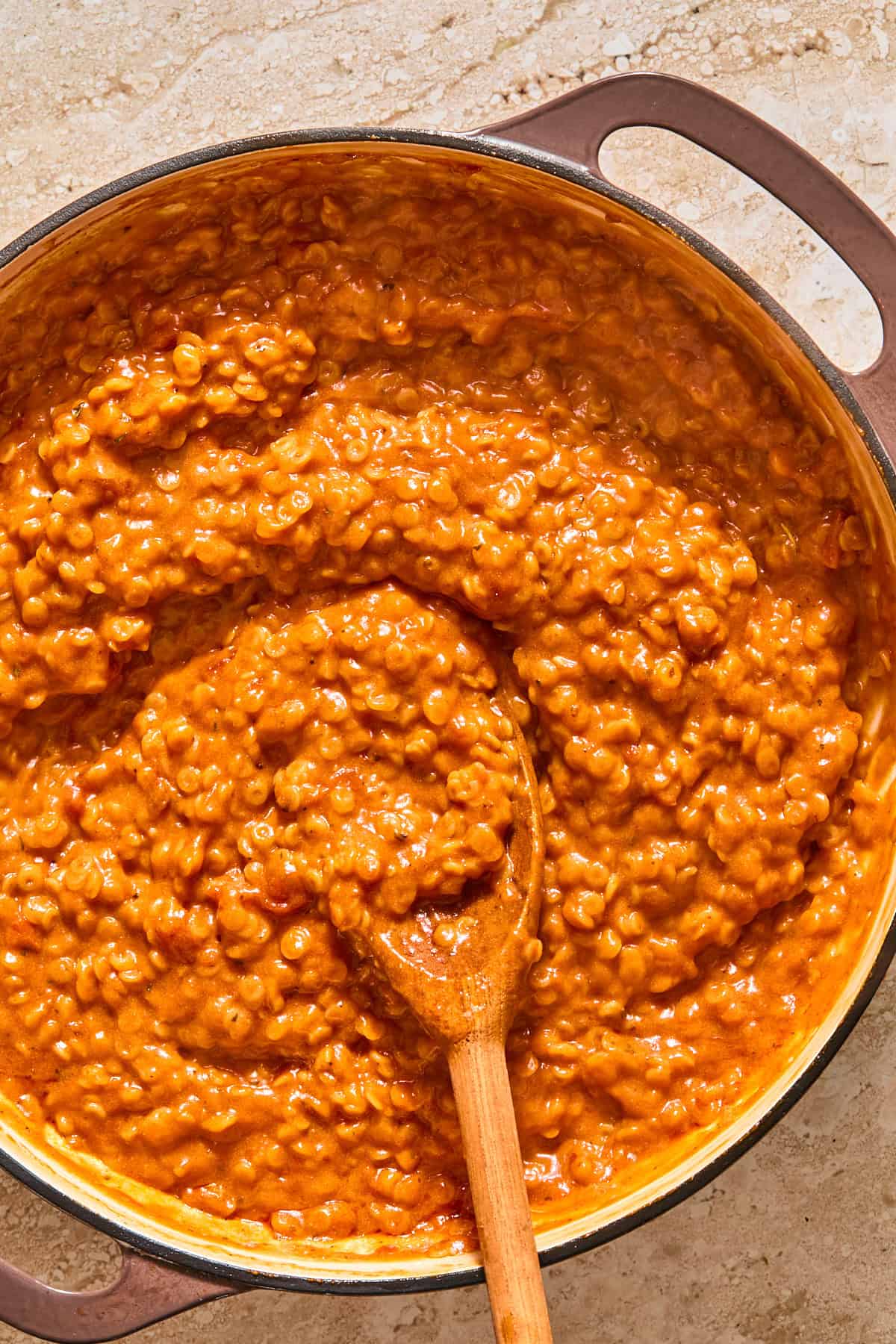 Cooked annelini pasta in the sauce making gluten-free spaghettiOs.