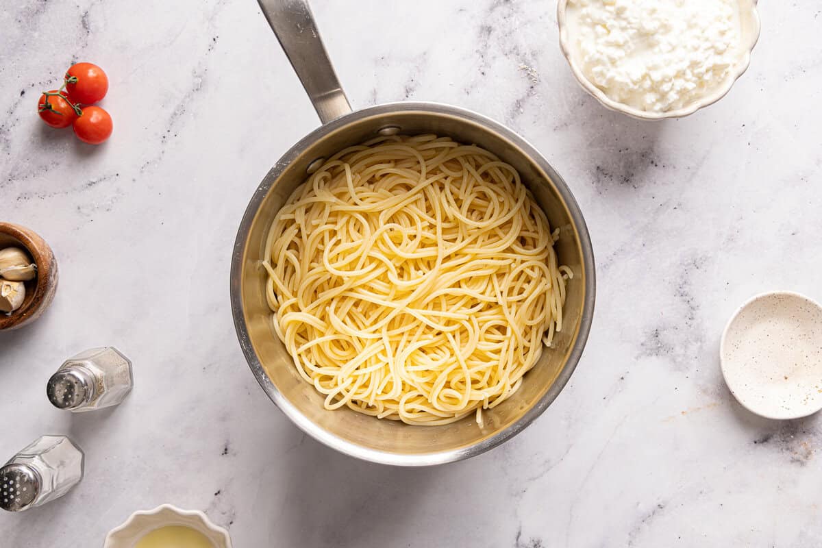 Cooked pasta in a large pot after draining