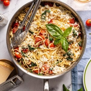 cottage cheese pasta in a skillet with basil on top