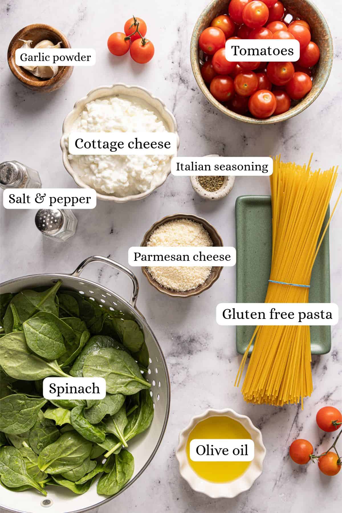 Flat lay of cottage cheese pasta recipe ingredients labeled on a counter.
