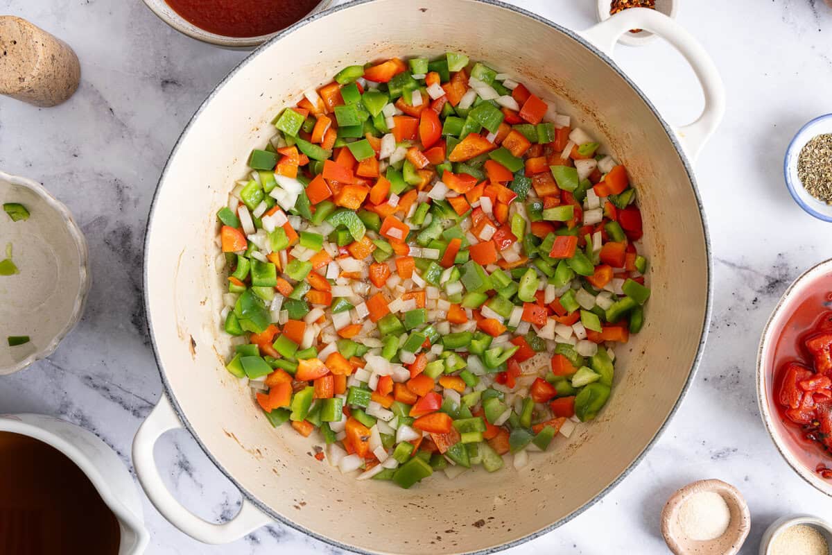 diced veggies cooking in a skillet